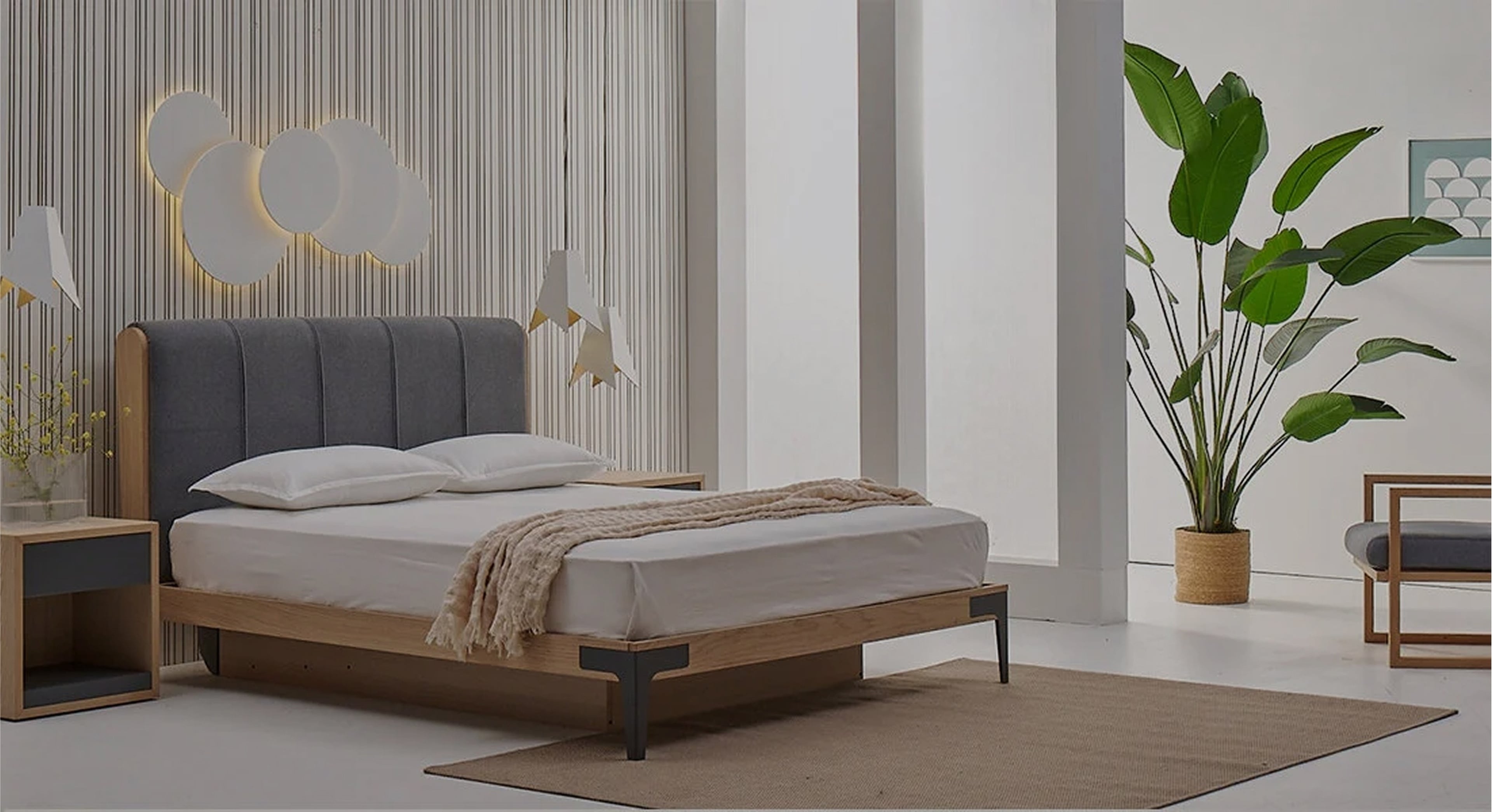 Photo of a cosy bedroom with the designer bed Mons in it